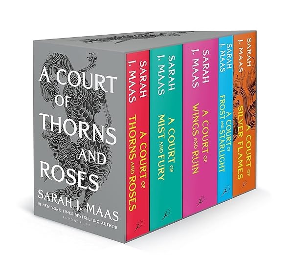 a row of books on a white background from A Court of Thorns and Roses from Books In Chronological Order