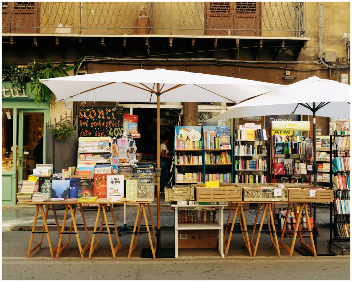 Outdoor bookstore with books displayed on tables from Popular Fantasy Series Collections for Sale (Best Stores) from BICO